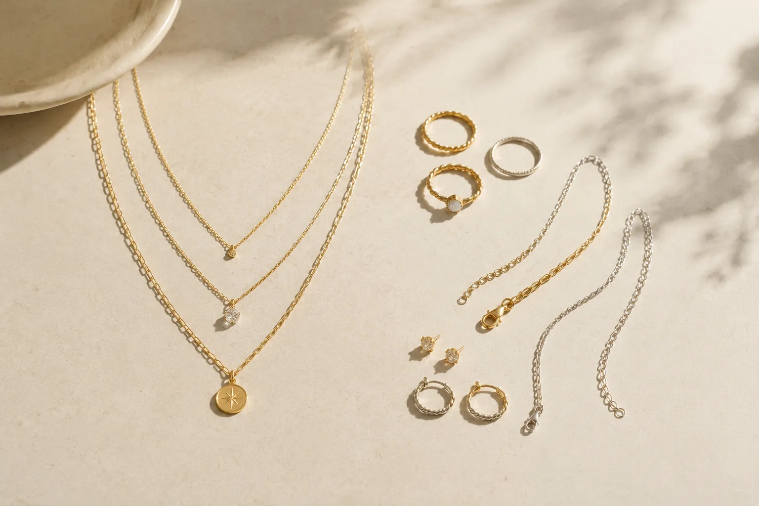 Generic layered necklaces arranged beside separate jewelry pieces to show set styling versus mix-and-match options.